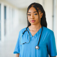 portrait-confident-african-american-female-doctor-medical-professional-writing-patient-notes-isolated-hospital-clinic-hallway-windows-background-positive-face-expression.jpg